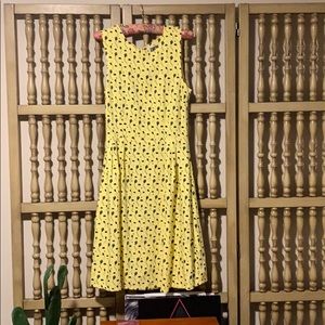 Yellow dress with kites and clouds